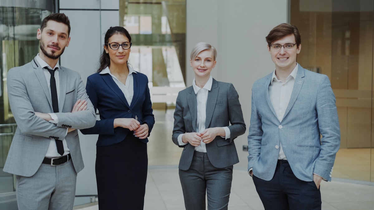 Business team wearing matching custom uniform hats on the job