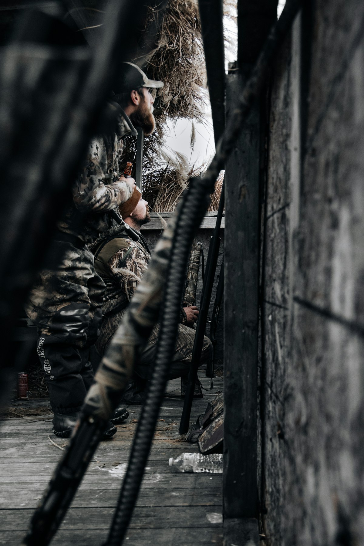 Group of outdoor workers wearing matching camo caps