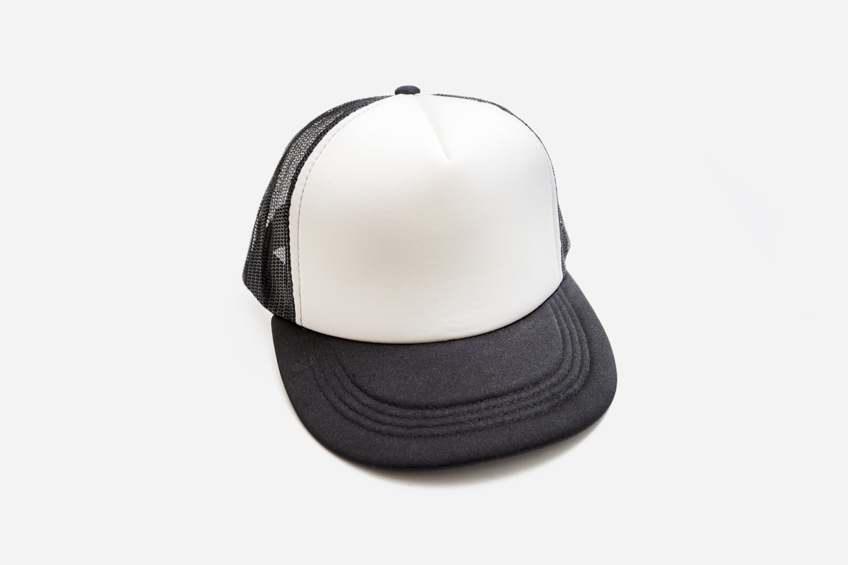Worker wearing a custom embroidered trucker hat on the job