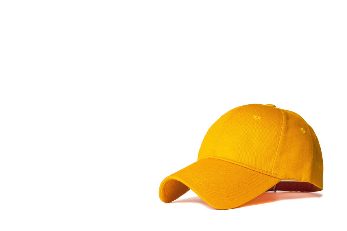 Close-up of embroidered logo on a structured snapback cap