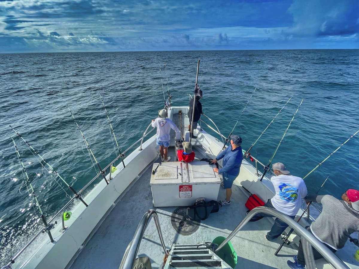 Charter fishing boat heading out with branded crew