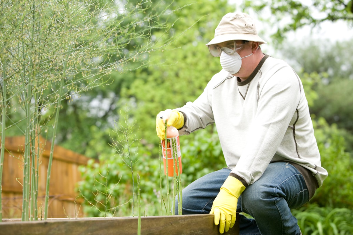 Pest control technician in branded uniform and cap