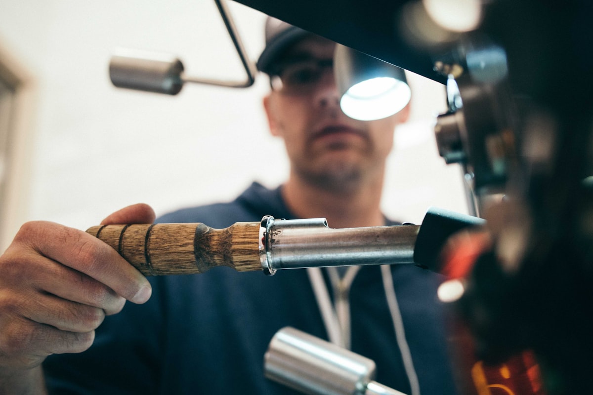 Plumber wearing a custom embroidered hat on the job