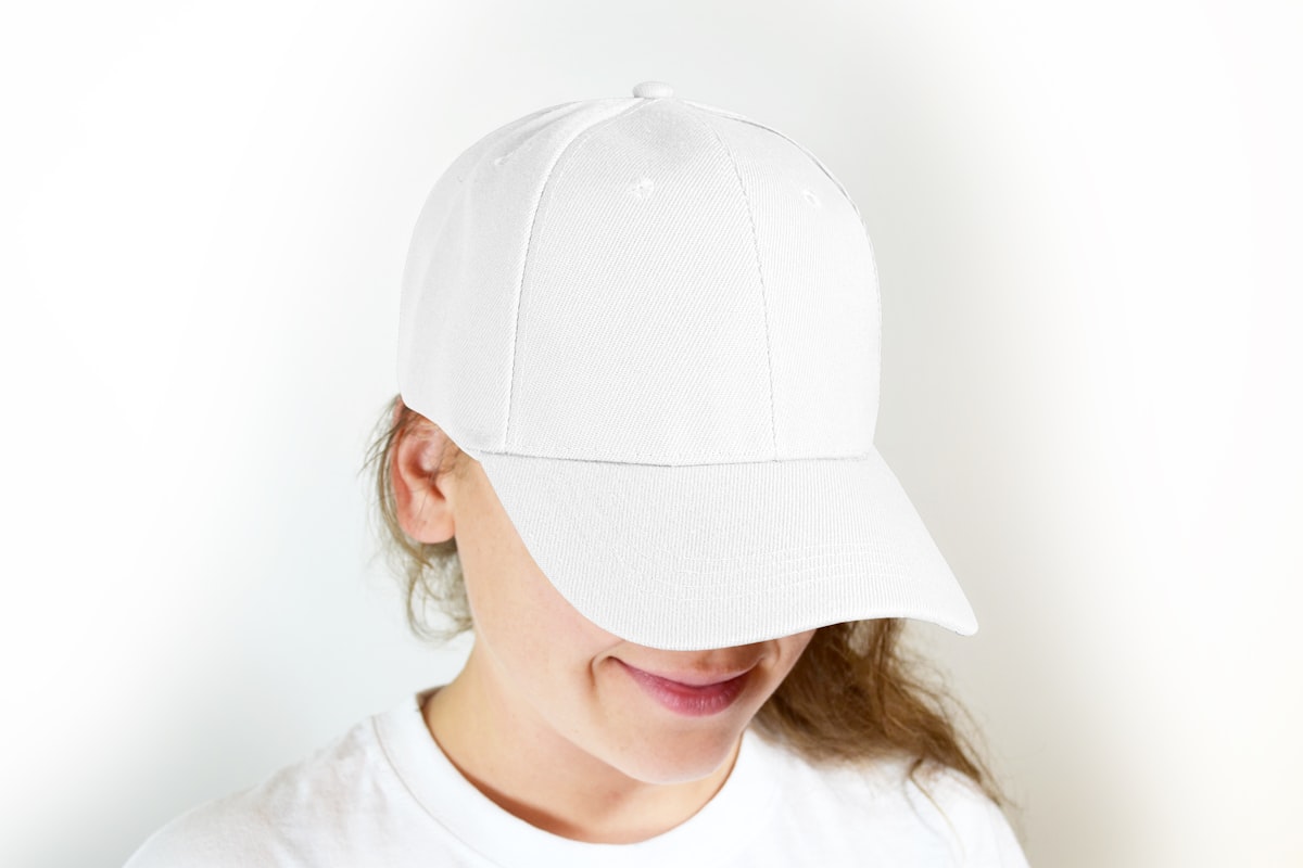 Team members wearing matching branded snapback caps outdoors