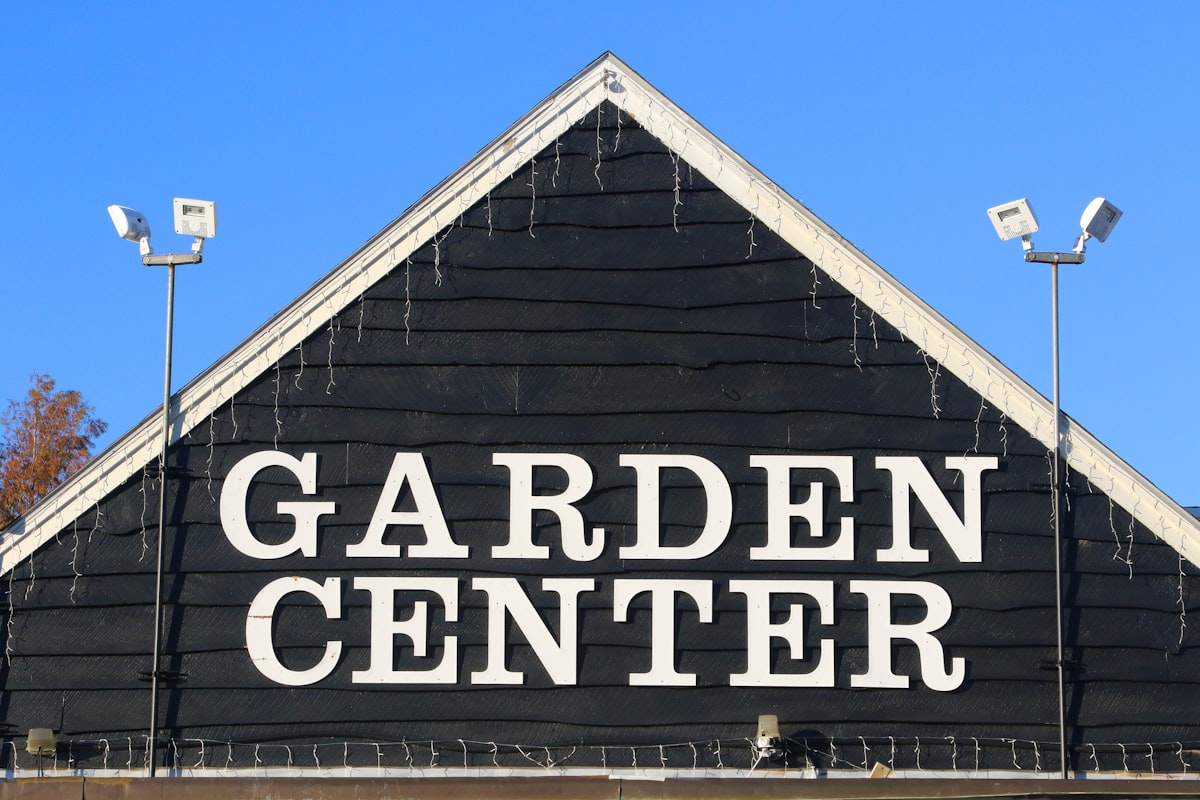 Garden center plant nursery with staff tending plants